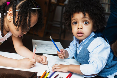 kids-coloring-at-table